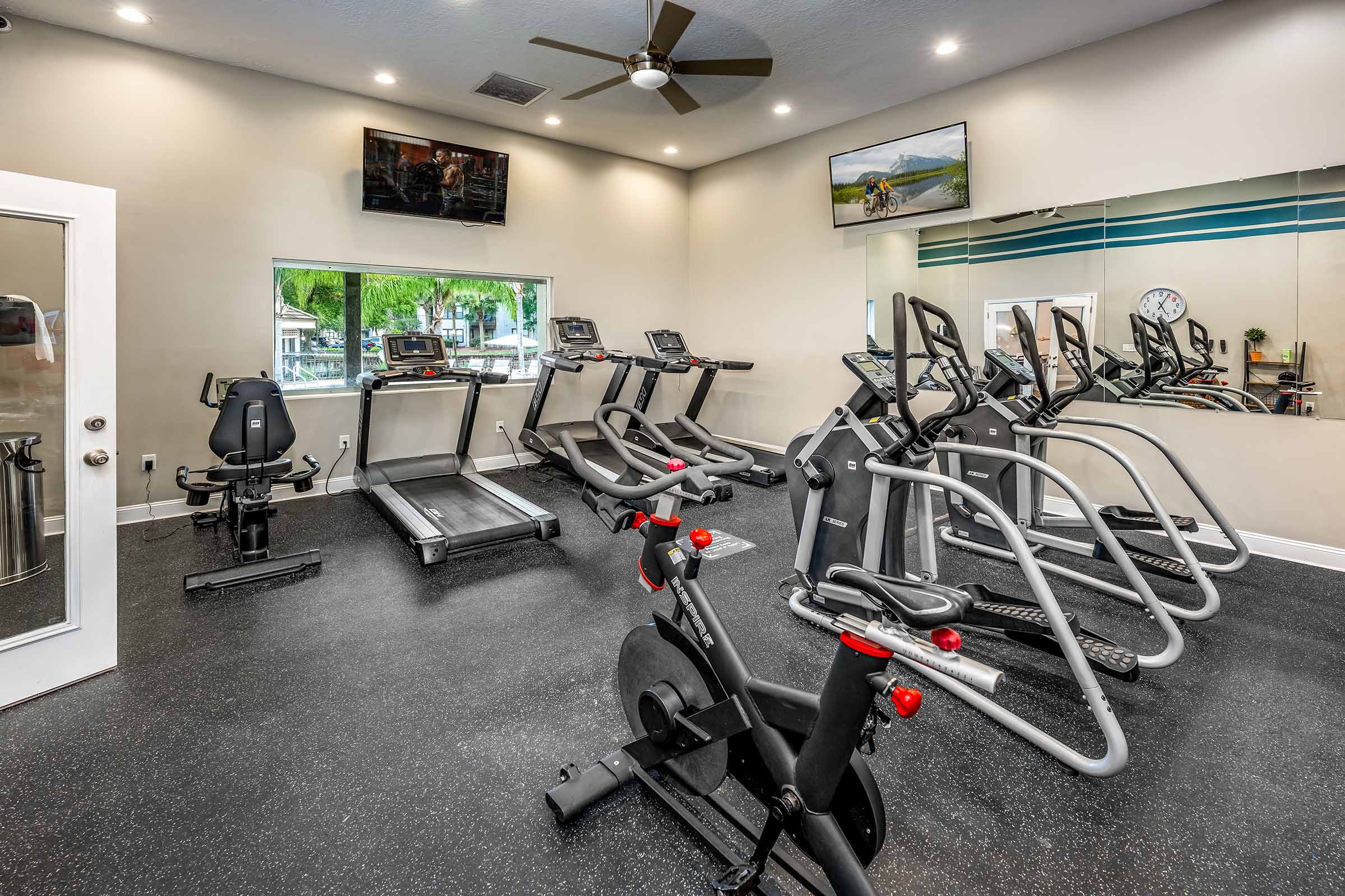 Fitness center with cardio equipment and weights at the Meridian